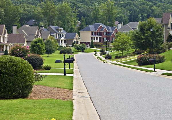 A street on a quiet day in a suburban neighborhood.